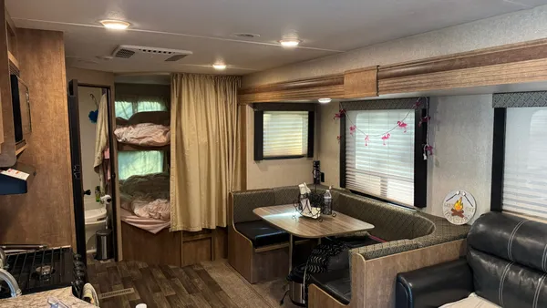 a view of a livingroom with furniture and window