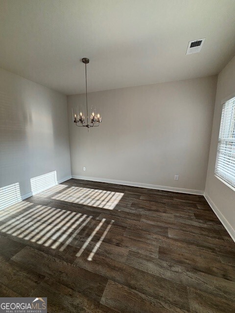 343 Jarrett Street, Unit 147 Fairburn, GA 30213 - Photo 17 of 22 a view of a room with wooden floor and ceiling fan