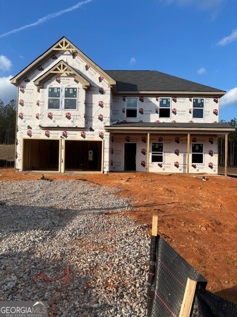 343 Jarrett Street, Unit 147 Fairburn, GA 30213 - Photo 5 of 22 a front view of a house with a yard