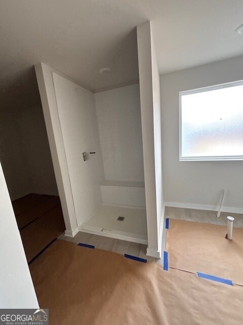 343 Jarrett Street, Unit 147 Fairburn, GA 30213 - Photo 6 of 22 a view of an empty room with a window