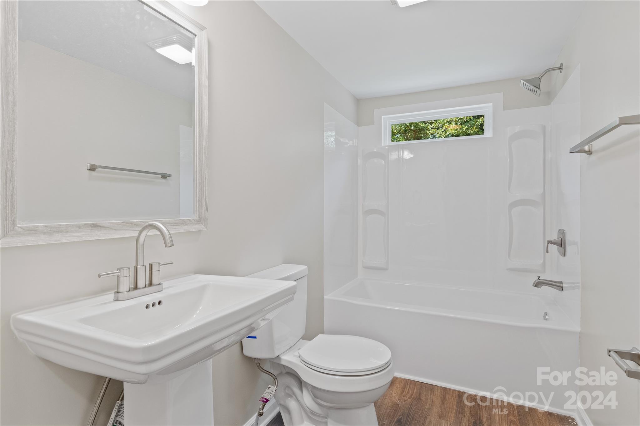 22 Potter Street Mill Spring, NC 28756 - Photo 14 of 15 a bathroom with a sink a toilet and shower