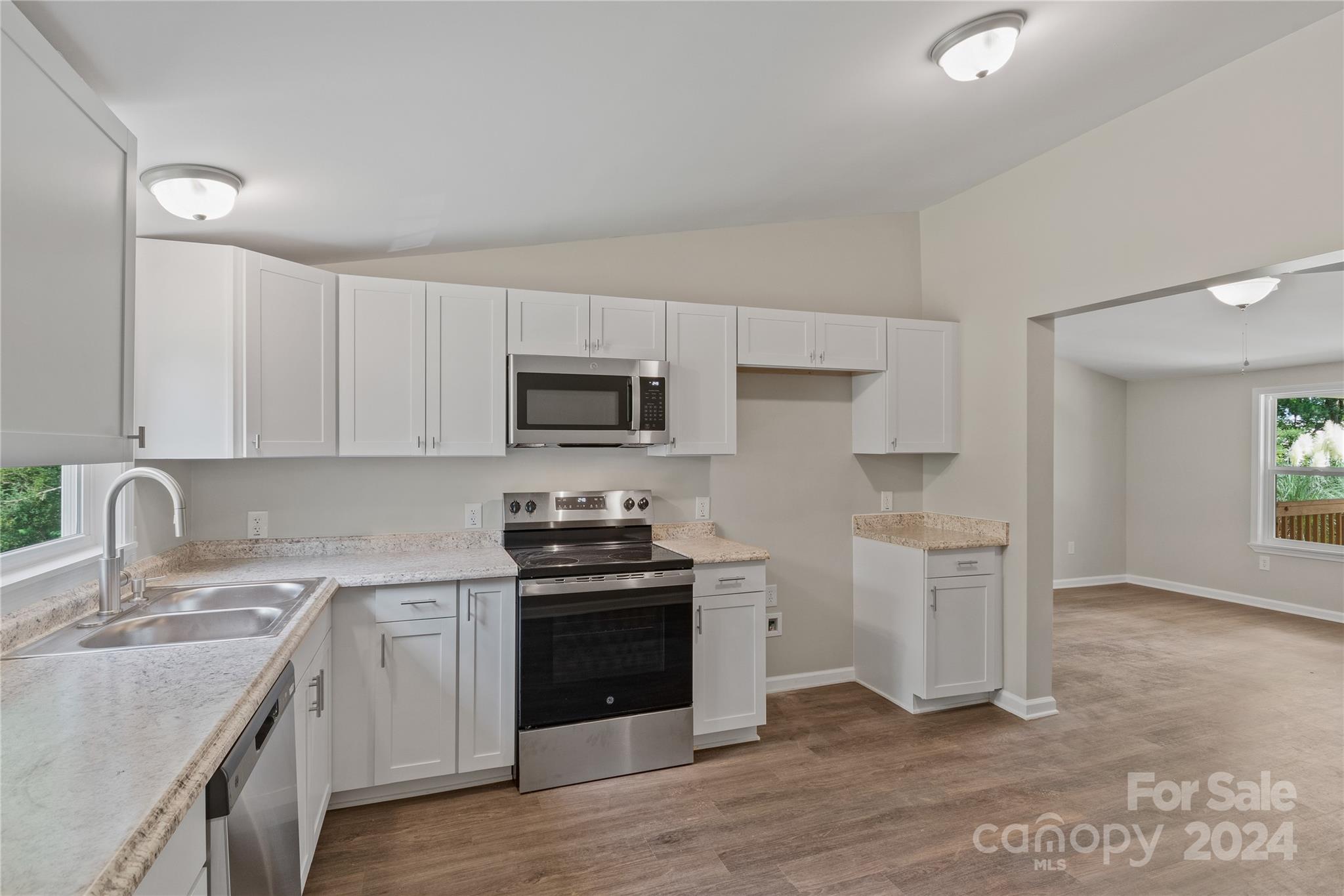 22 Potter Street Mill Spring, NC 28756 - Photo 7 of 15 a kitchen with a sink cabinets and stainless steel appliances
