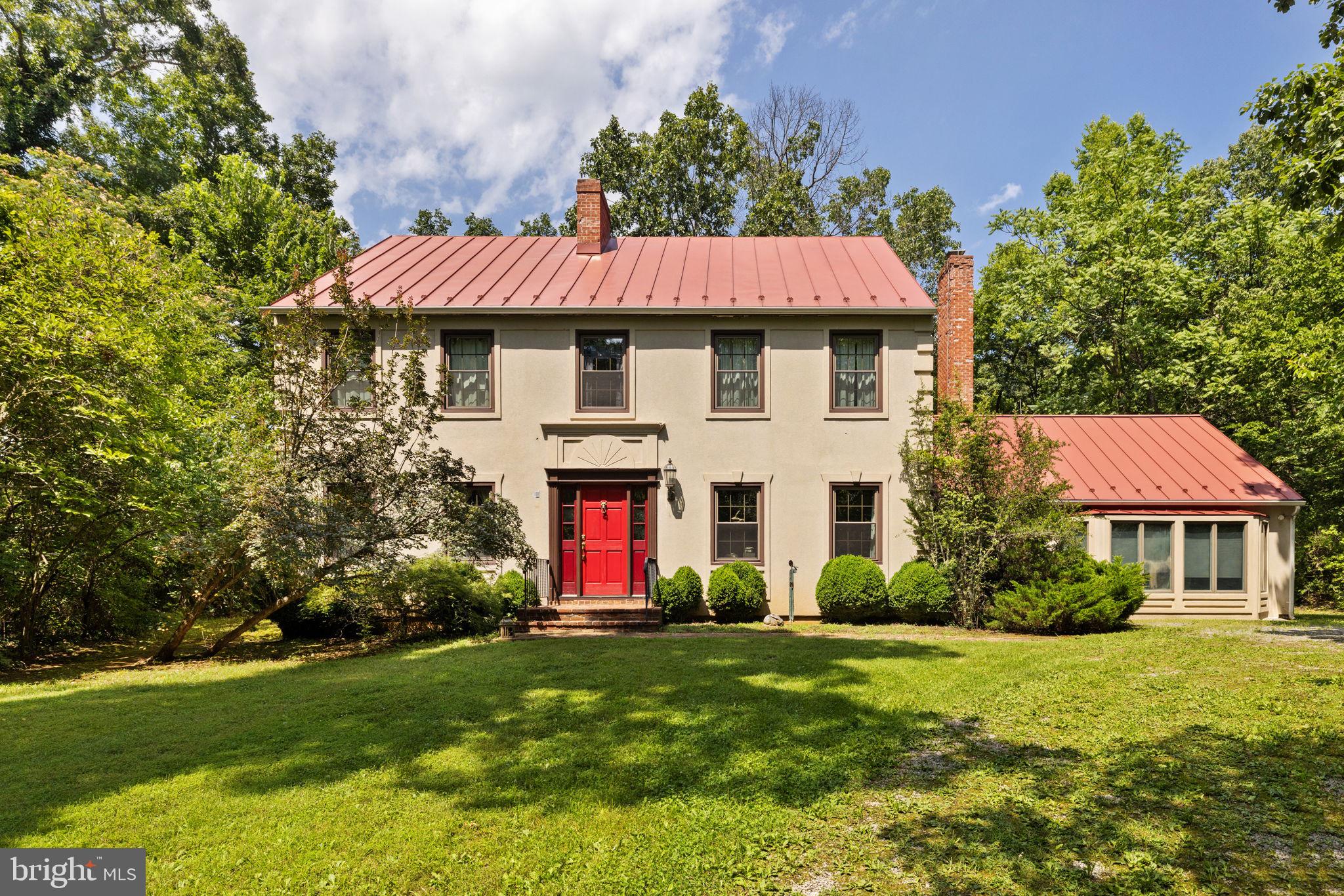 961 Summerville Road Boyce, VA 22620 - Photo 2 of 57 a front view of a house with a yard and garage