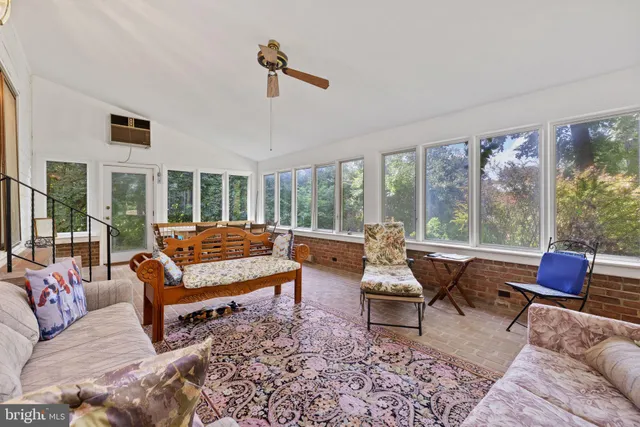 a bedroom with furniture and a fireplace