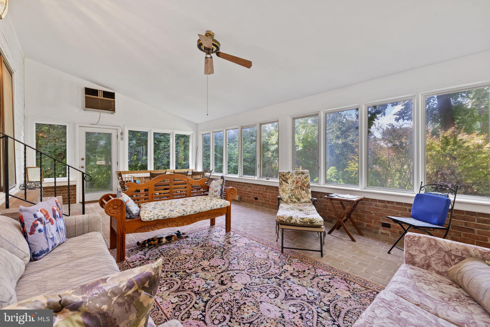 961 Summerville Road Boyce, VA 22620 - Photo 26 of 57 a living room with furniture and floor to ceiling windows