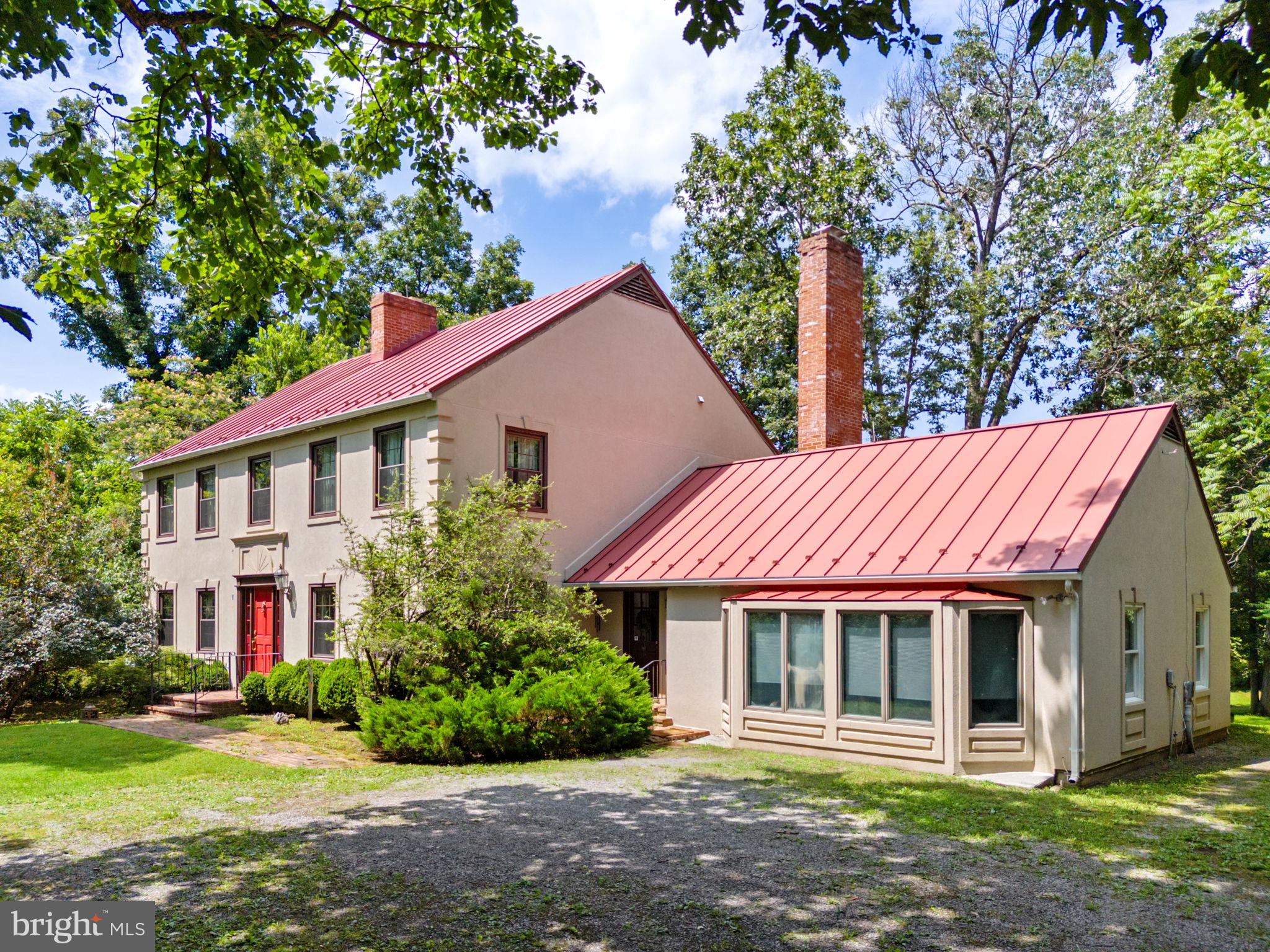 961 Summerville Road Boyce, VA 22620 - Photo 3 of 57 a front view of a house with a garden
