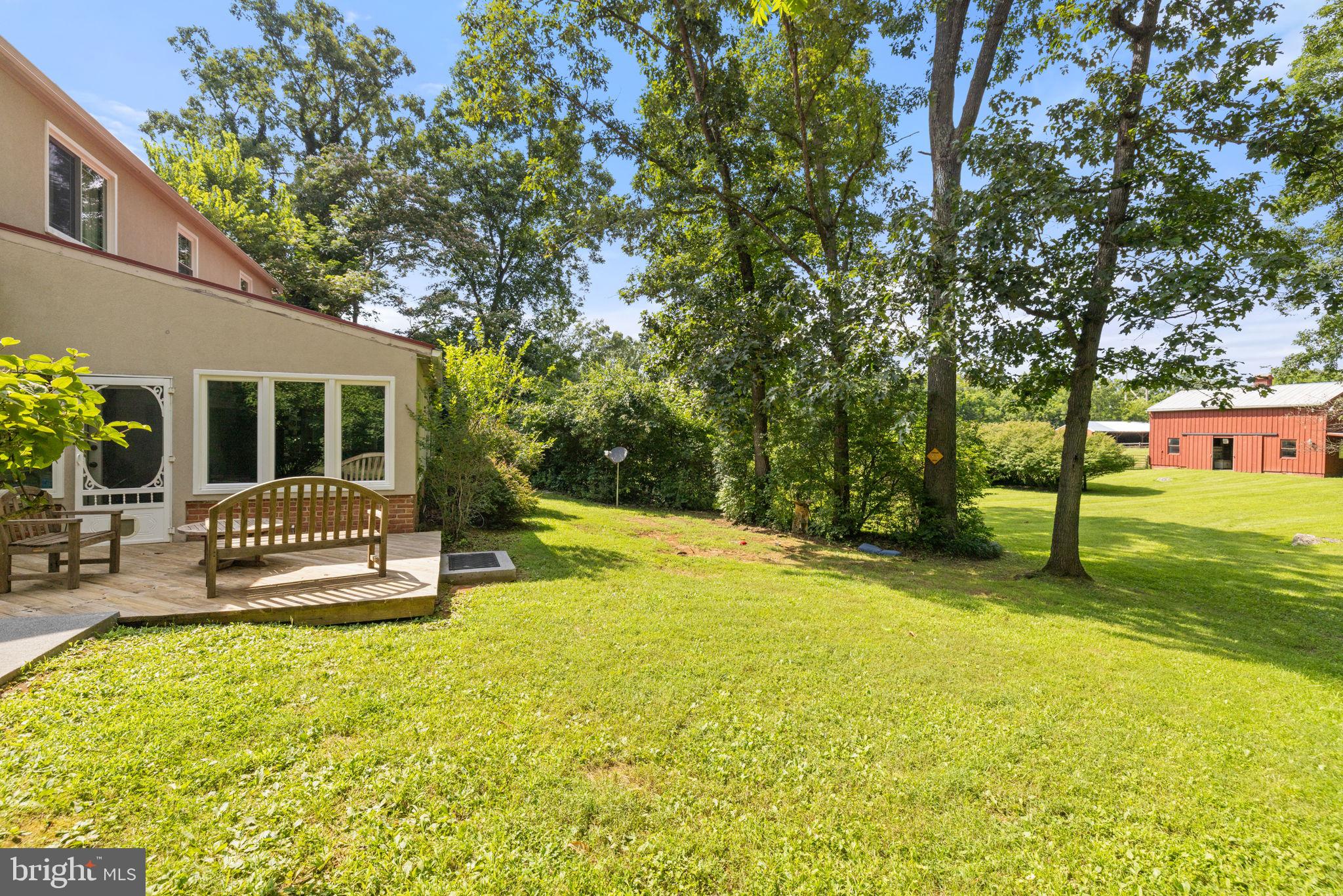 961 Summerville Road Boyce, VA 22620 - Photo 40 of 57 a view of a house with a patio and a yard