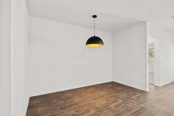a view of empty room with a fan
