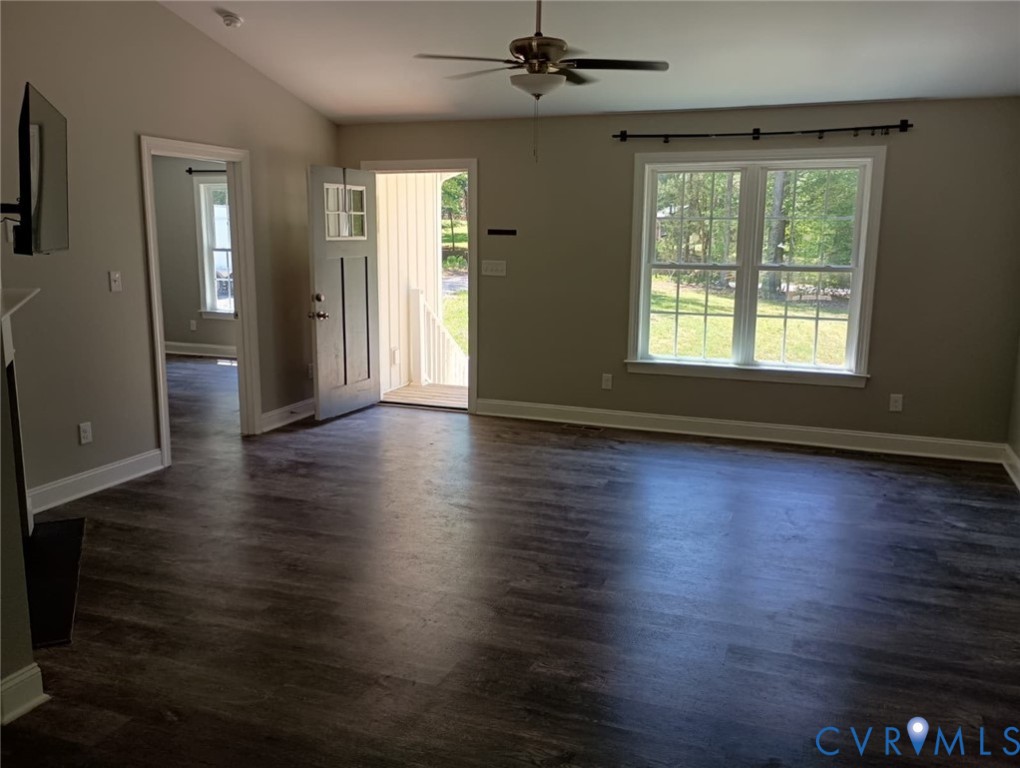 741 Grapevine Road Sandston, VA 23150 - Photo 4 of 16 an empty room with wooden floor and windows