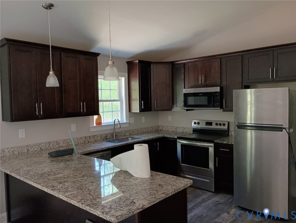 741 Grapevine Road Sandston, VA 23150 - Photo 6 of 16 a kitchen with stainless steel appliances granite countertop a sink refrigerator and microwave