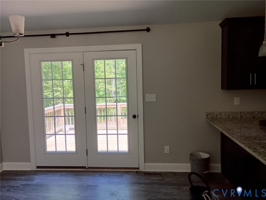 741 Grapevine Road Sandston, VA 23150 - Photo 7 of 16 a view of a kitchen with wooden floor and a window