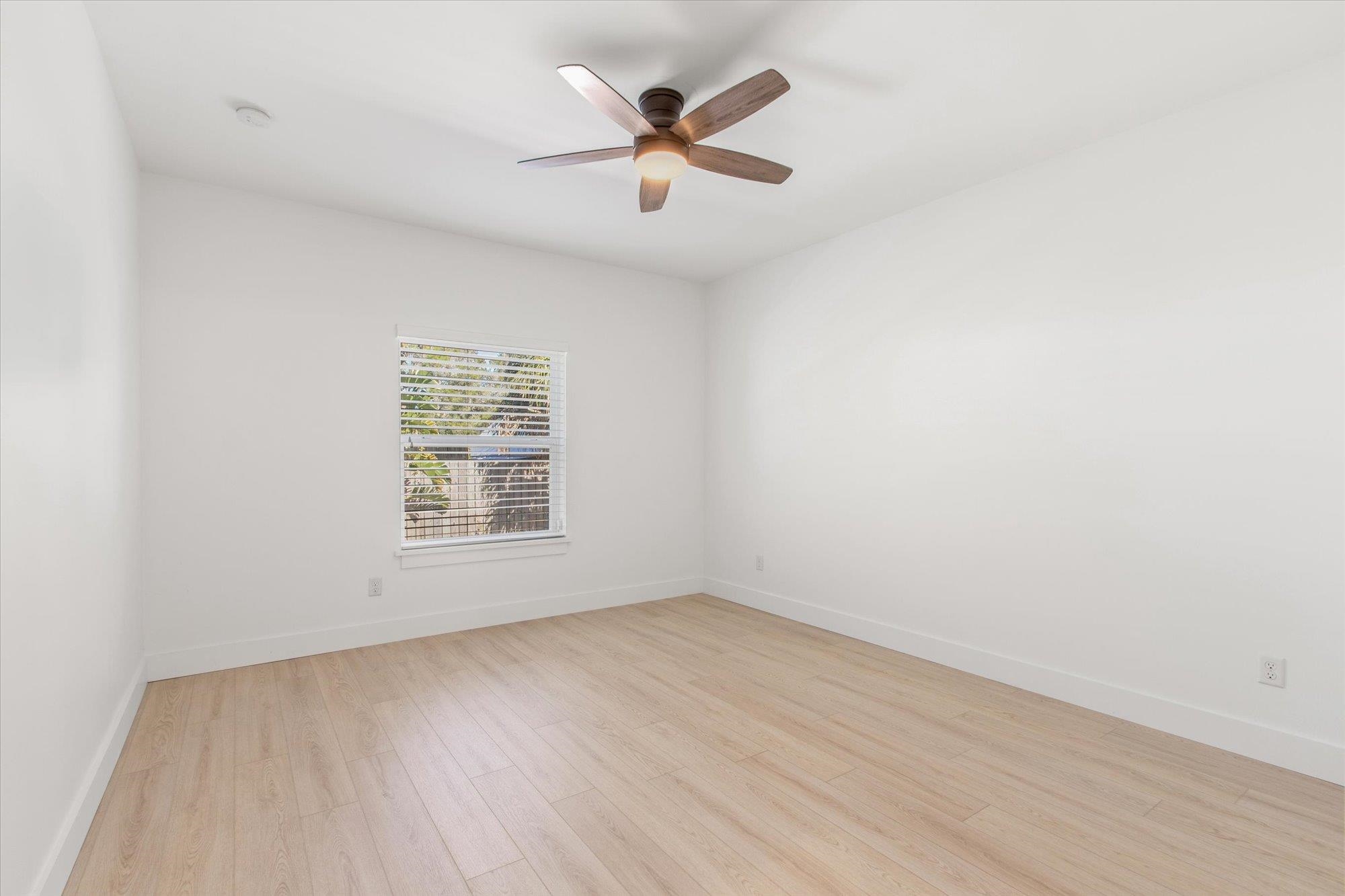 330 Biscayne Avenue St. Augustine, FL 32080 - Photo 19 of 49 an empty room with wooden floor and ceiling fan