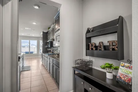 a kitchen with stainless steel appliances a stove a sink and a refrigerator