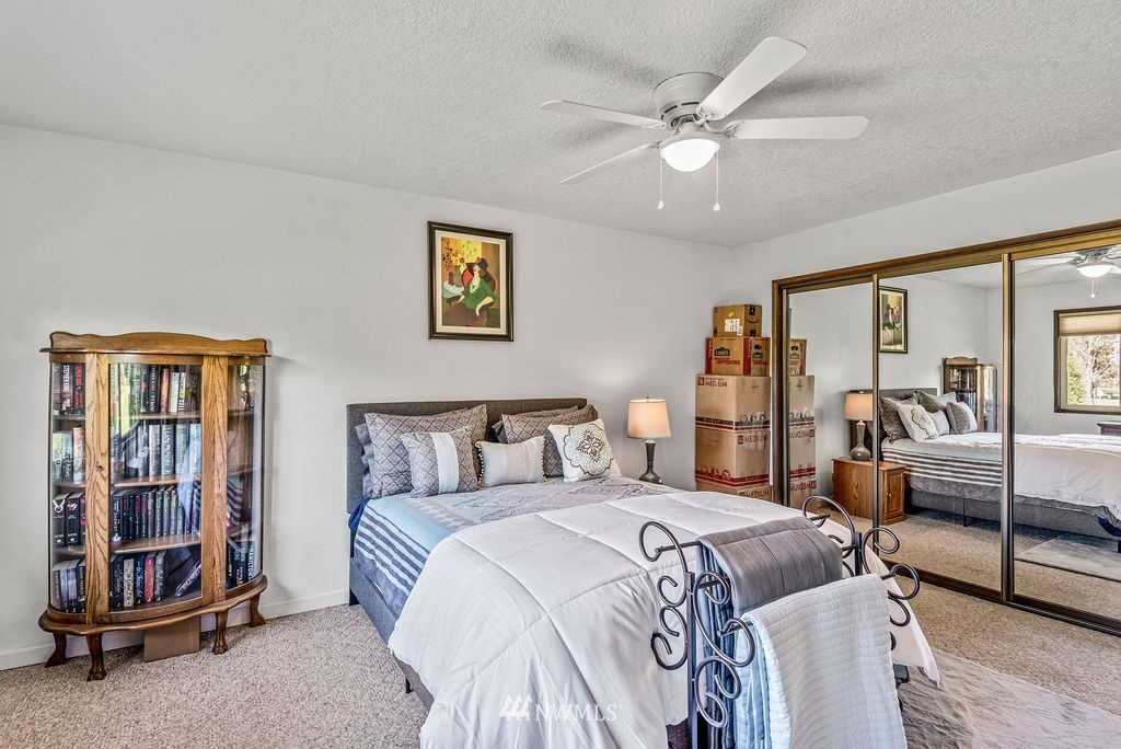 2363 40th Avenue, Unit 7 Longview, WA 98632 - Photo 13 of 25 a bed room with a bed and a couch
