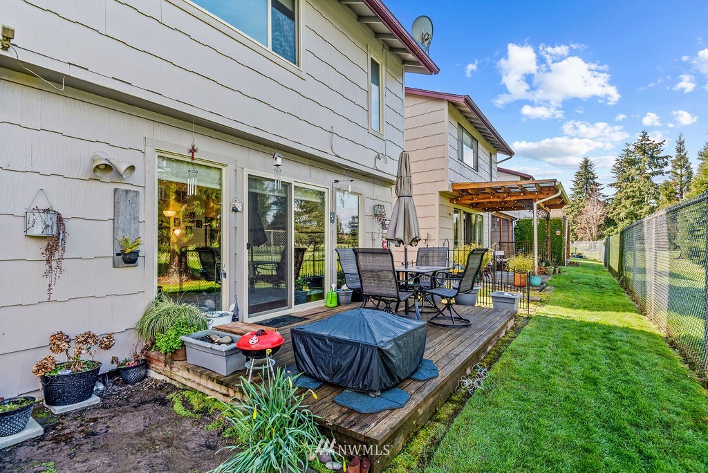 2363 40th Avenue, Unit 7 Longview, WA 98632 - Photo 19 of 25 a view of a patio with couches table and chairs and potted plants