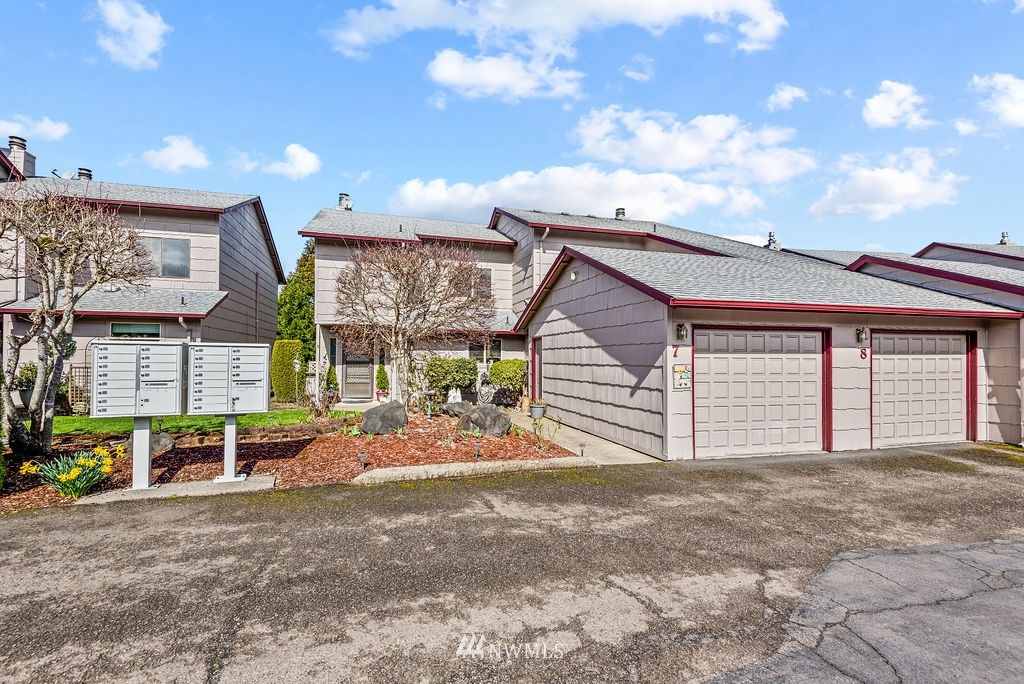 2363 40th Avenue, Unit 7 Longview, WA 98632 - Photo 23 of 25 a front view of a house with a garage