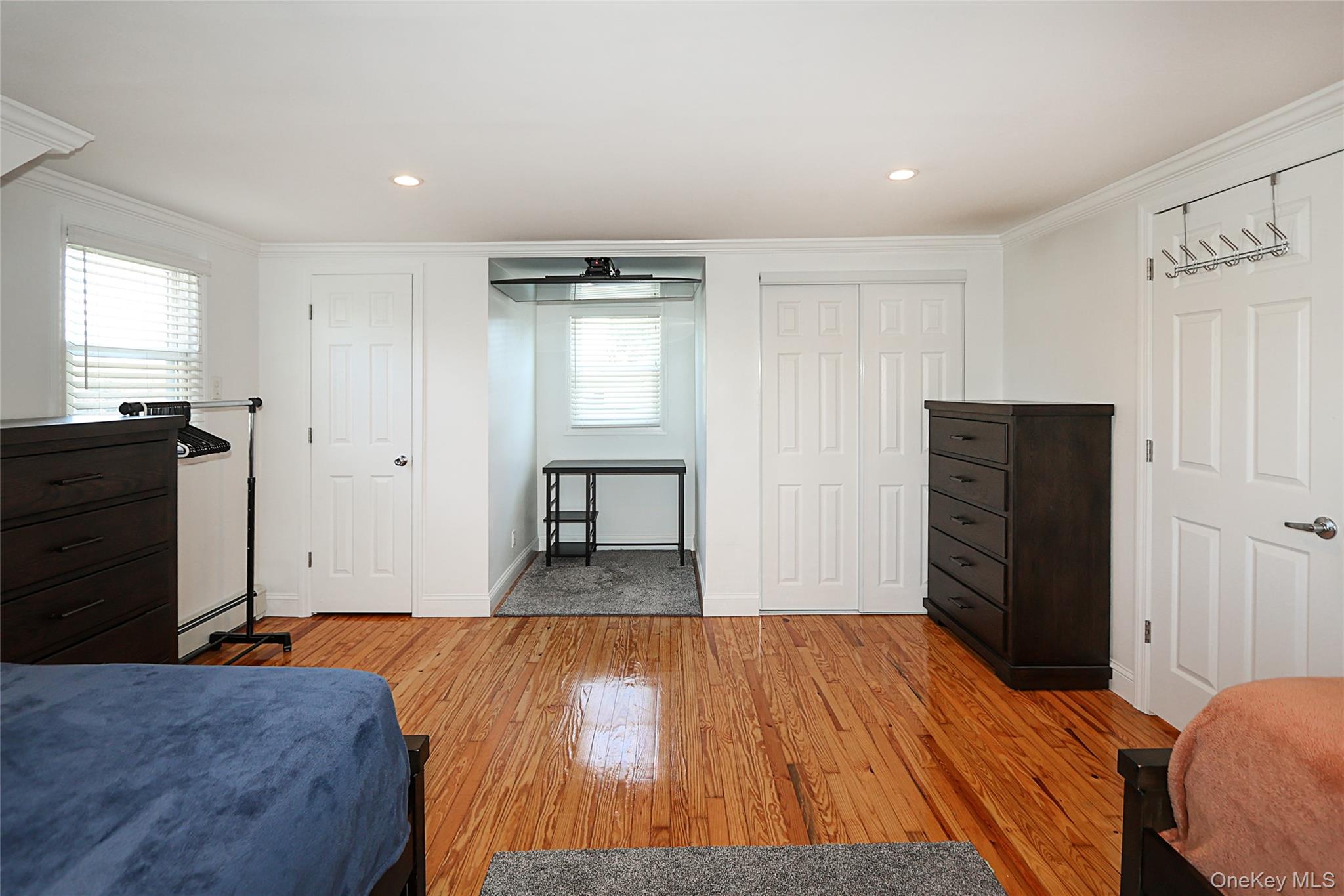 132 Bethel Road Albertson, NY 11507 - Photo 19 of 28 Bedroom featuring light wood-style flooring, ornamental molding, and recessed lighting