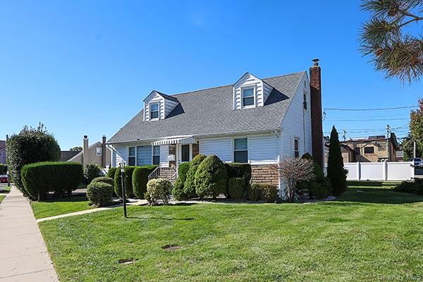 132 Bethel Road Albertson, NY 11507 - Photo 3 of 28 Cape cod house with a chimney and brick siding