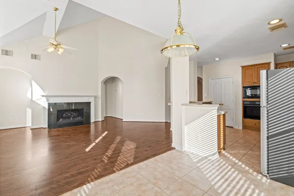 a view of an empty room and fire place