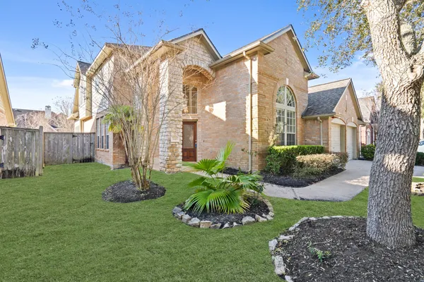 a view of a front of a house with a yard