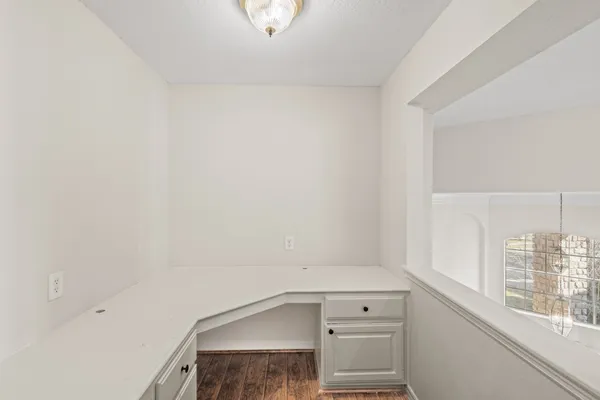 a view of storage and utility room with a window