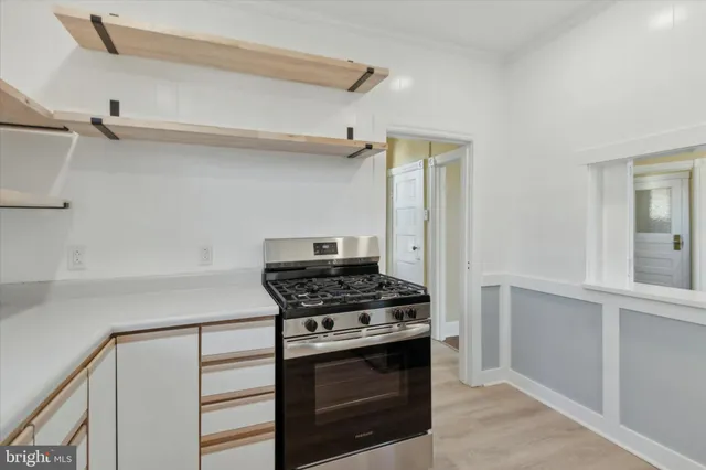 a kitchen with cabinets and appliances