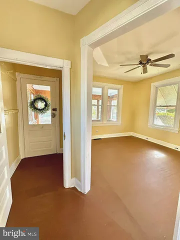 a view of an empty room with a window