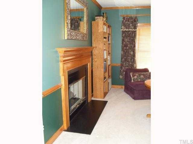 116 Beckford Road Cary, NC 27518 - Photo 8 of 12 Dual Room Gas Log Fireplace is a Special Feature within the Study or Could be A In-Law Suite! Studio/Study/Office