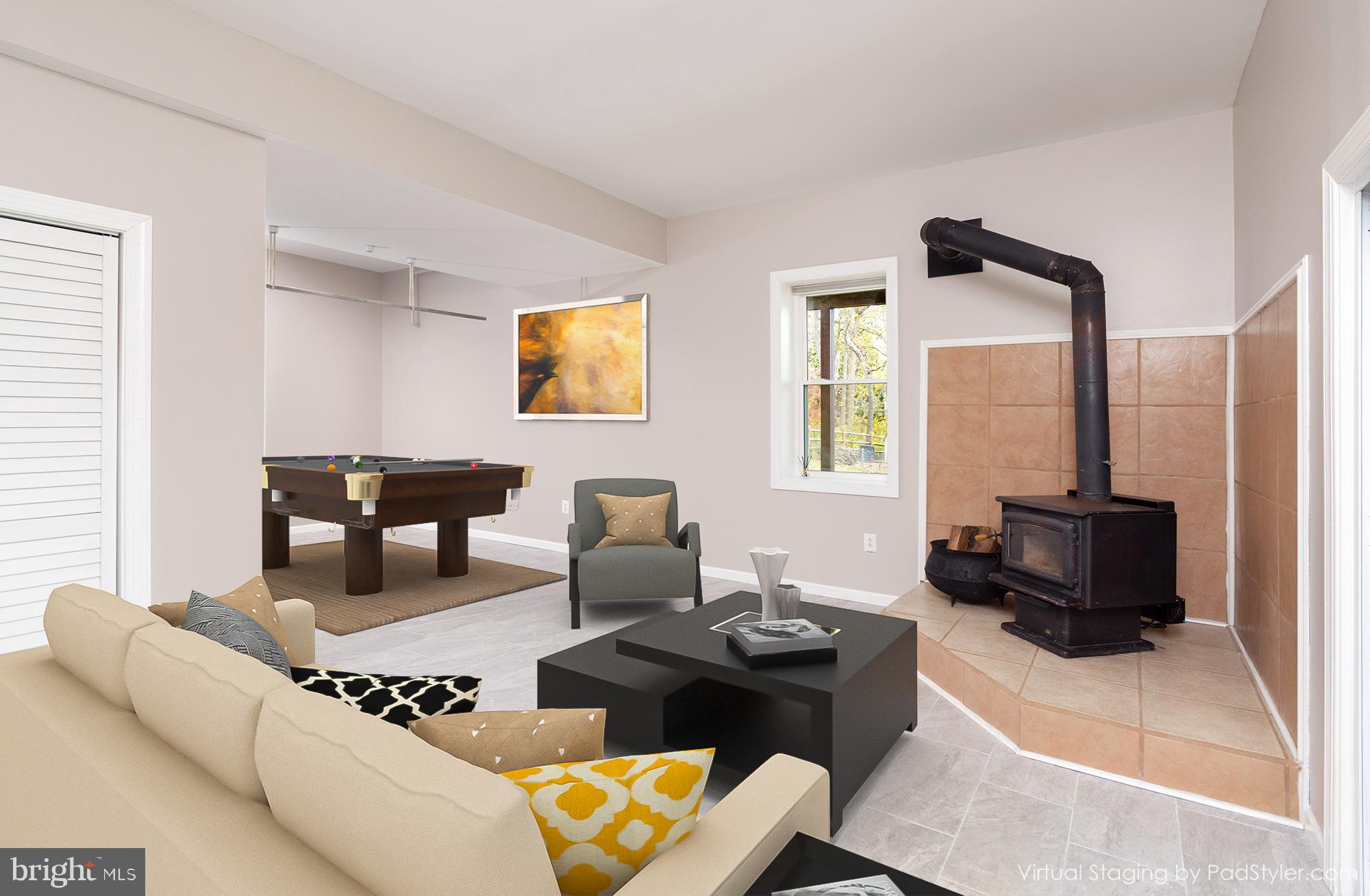 24515 Ridge Road Damascus, MD 20872 - Photo 35 of 53 Virtually staged sitting room by wood stove