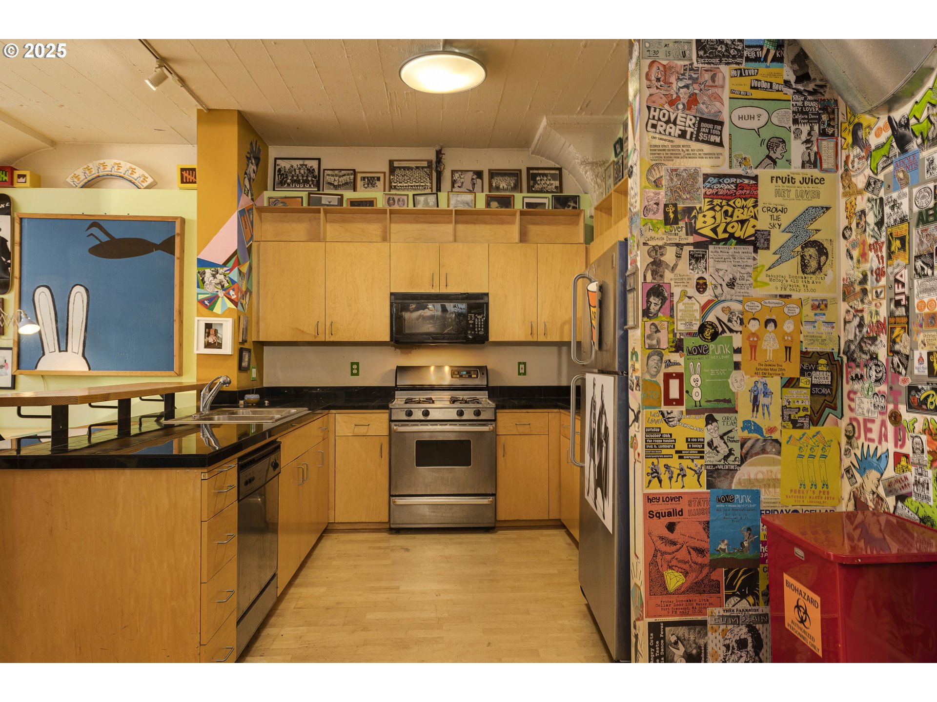 300 Northwest 8th Avenue, Unit 401 Portland, OR 97209 - Photo 15 of 37 a kitchen with stainless steel appliances granite countertop a sink and cabinets