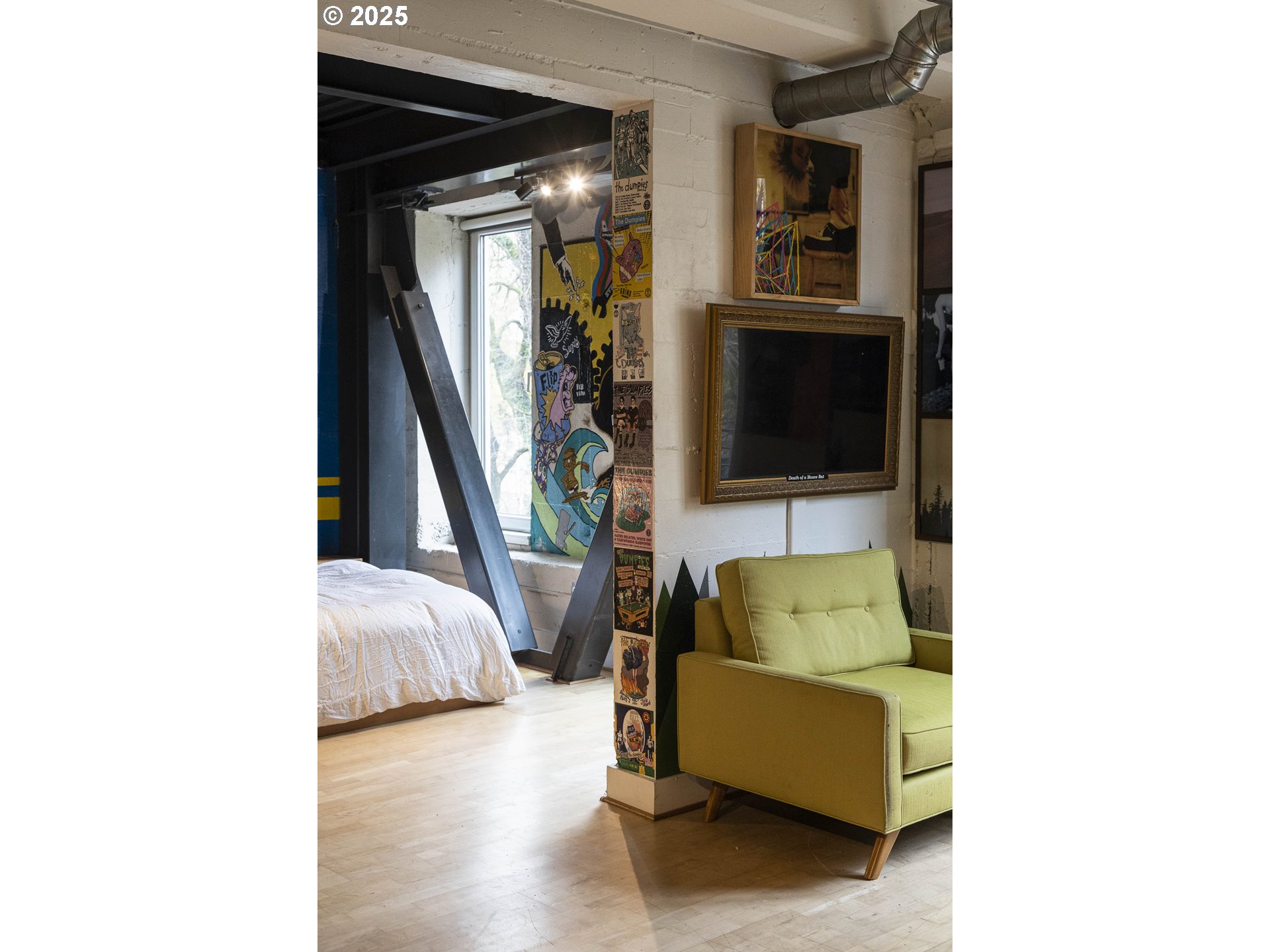 300 Northwest 8th Avenue, Unit 401 Portland, OR 97209 - Photo 22 of 37 a living room with furniture and a flat screen tv
