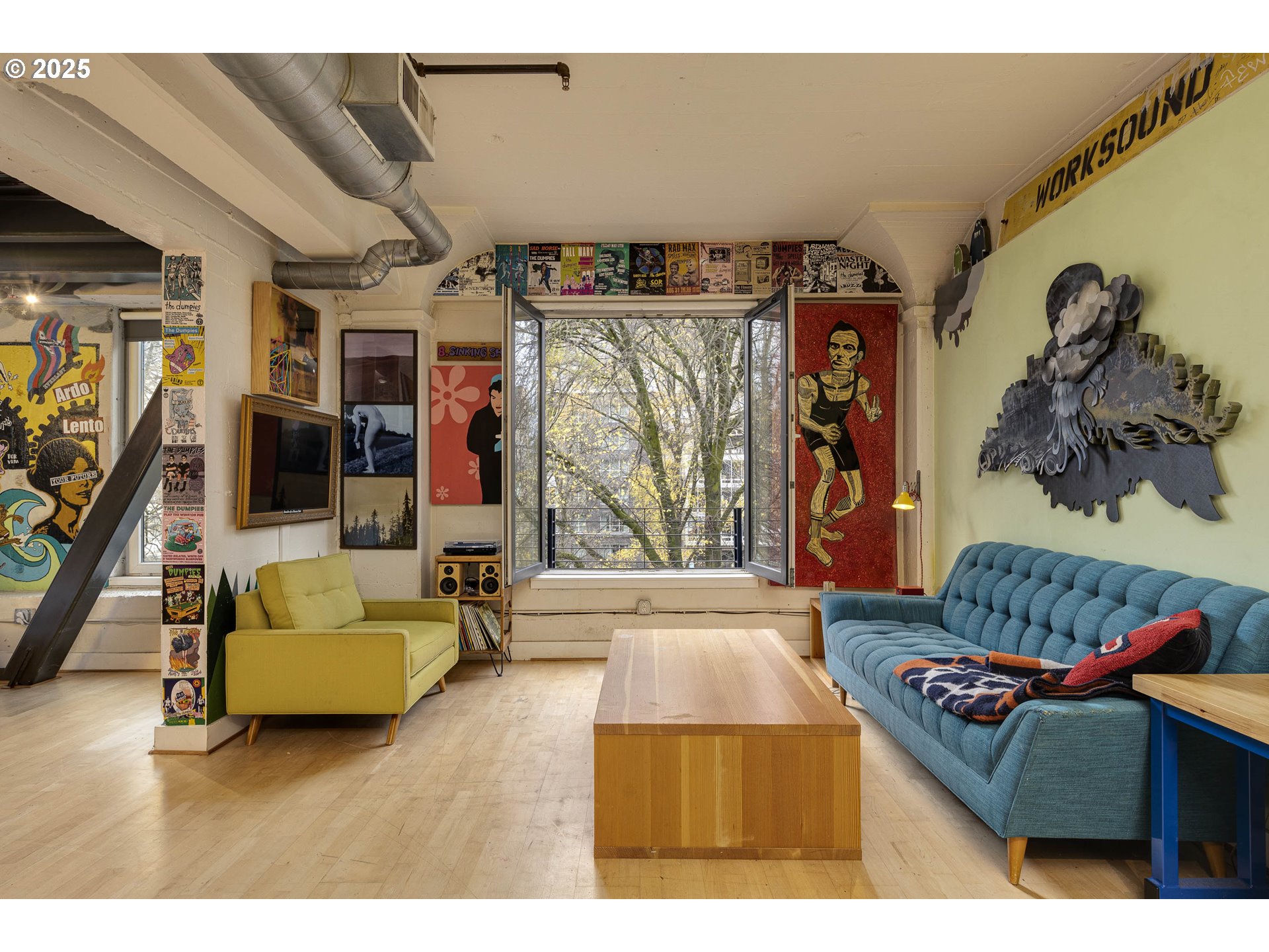 300 Northwest 8th Avenue, Unit 401 Portland, OR 97209 - Photo 3 of 37 a living room with furniture and a window