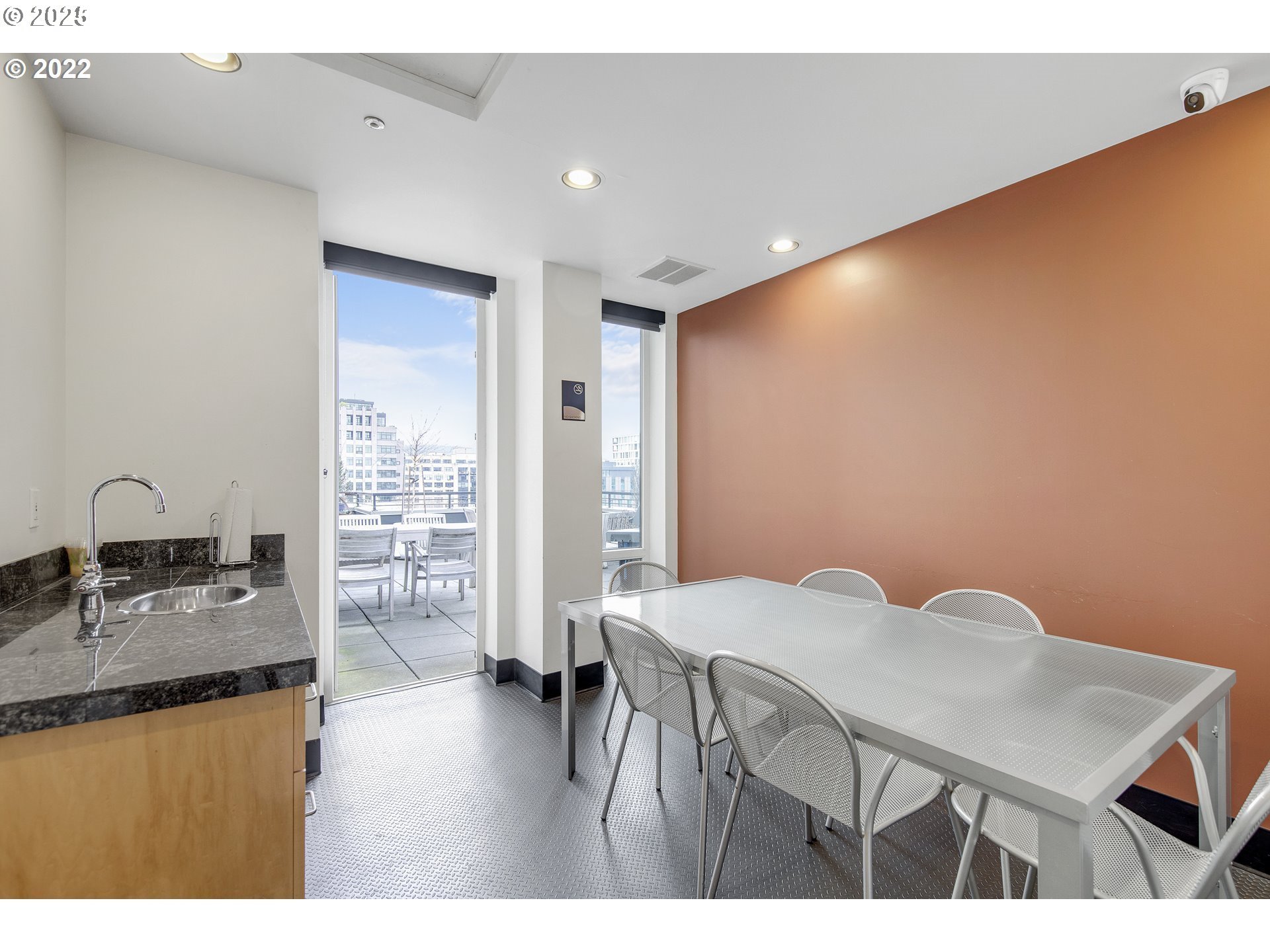 300 Northwest 8th Avenue, Unit 401 Portland, OR 97209 - Photo 35 of 37 a kitchen with a table and chairs