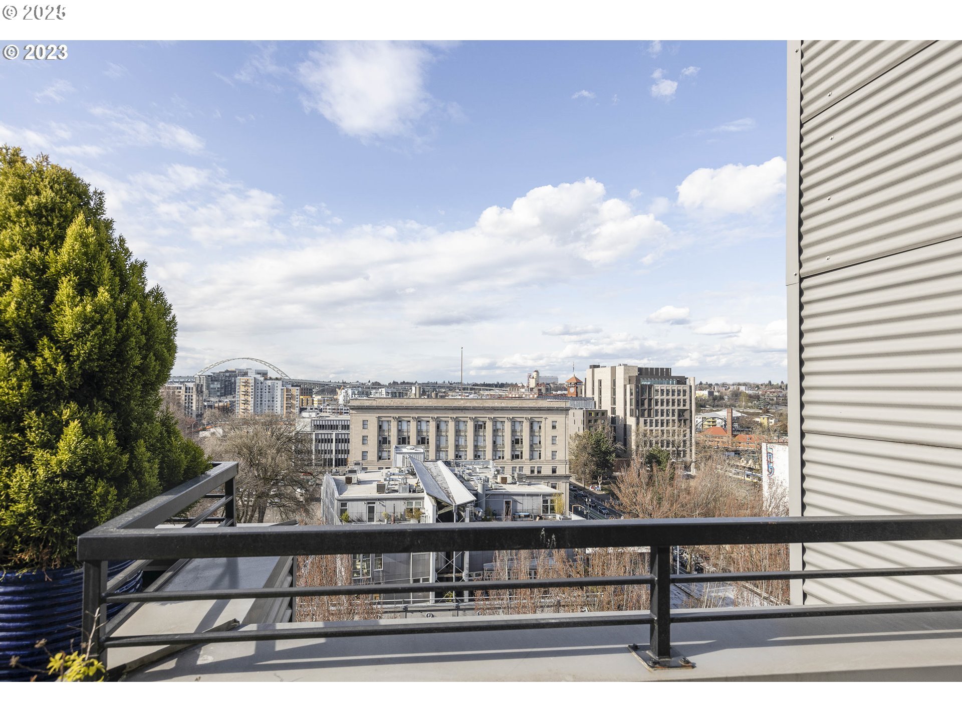 300 Northwest 8th Avenue, Unit 401 Portland, OR 97209 - Photo 36 of 37 a view of a lake from a balcony