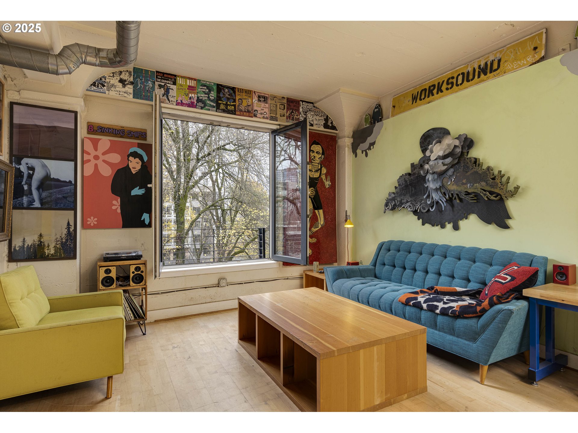 300 Northwest 8th Avenue, Unit 401 Portland, OR 97209 - Photo 4 of 37 a living room with furniture and a large window