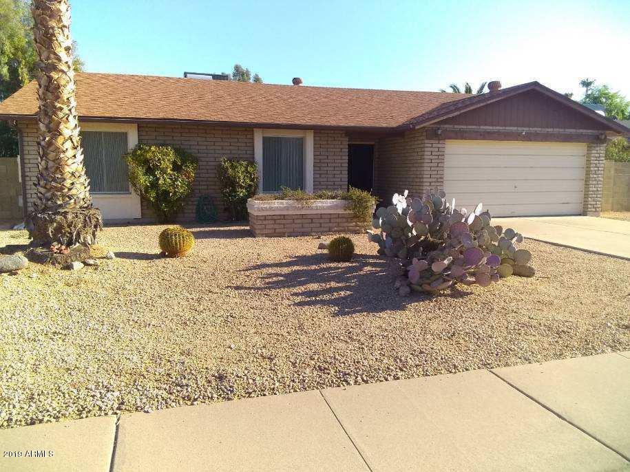 5933 East Spring Road Scottsdale, AZ 85254 - Photo 1 of 23 a front view of a house with garden