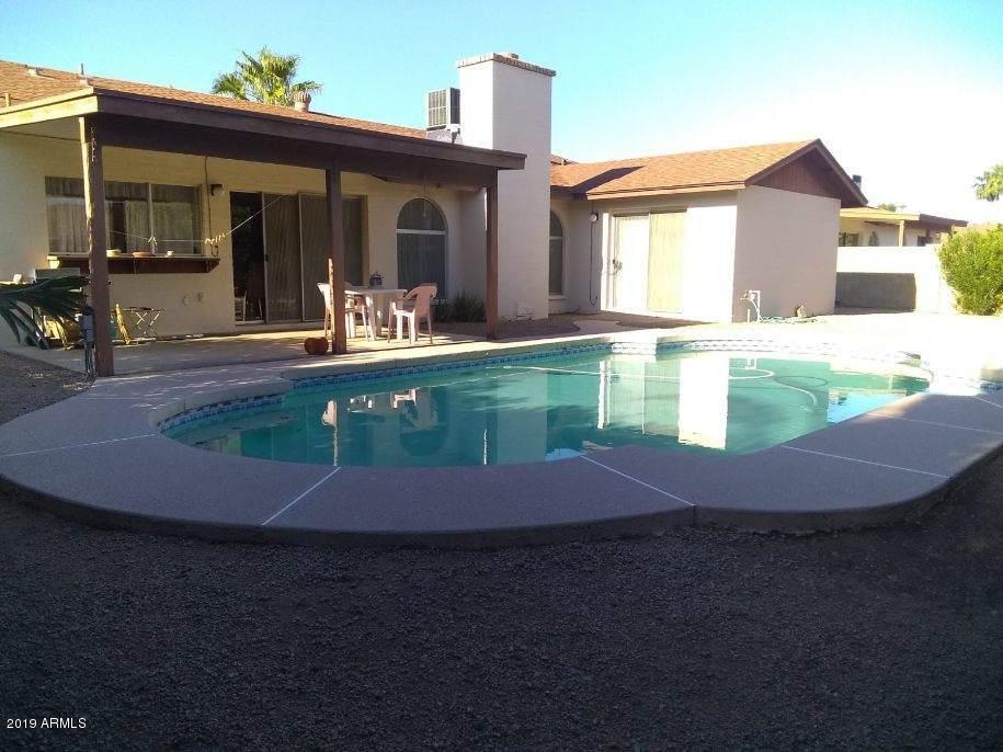 5933 East Spring Road Scottsdale, AZ 85254 - Photo 21 of 23 a view of a house with pool yard and a wooden deck
