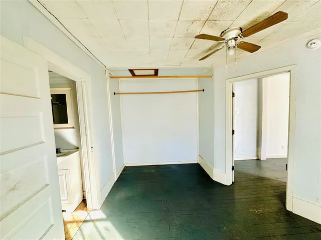 a view of a room with wooden floor
