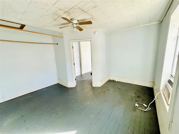 an empty room with a fireplace