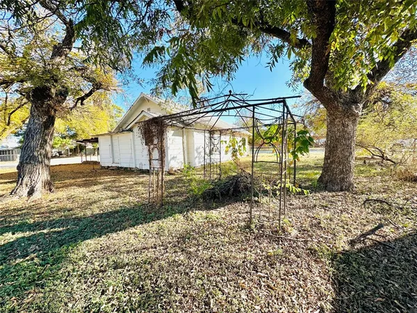 a backyard of a house with lots of green space