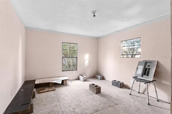 a view of an empty room with closet area