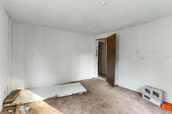a view of a hallway with seating area