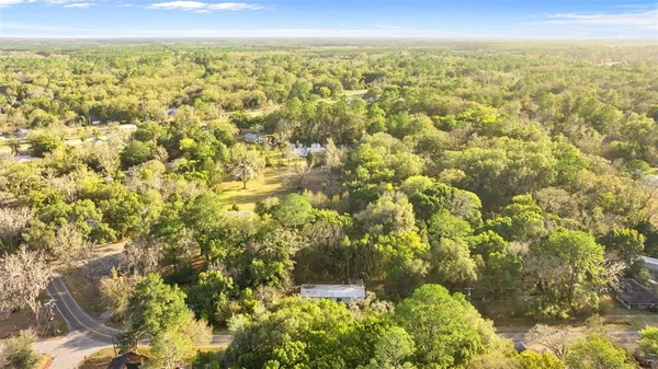 an aerial view of residential building and green space