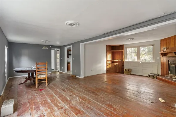 a living room with furniture window wooden floor and a rug