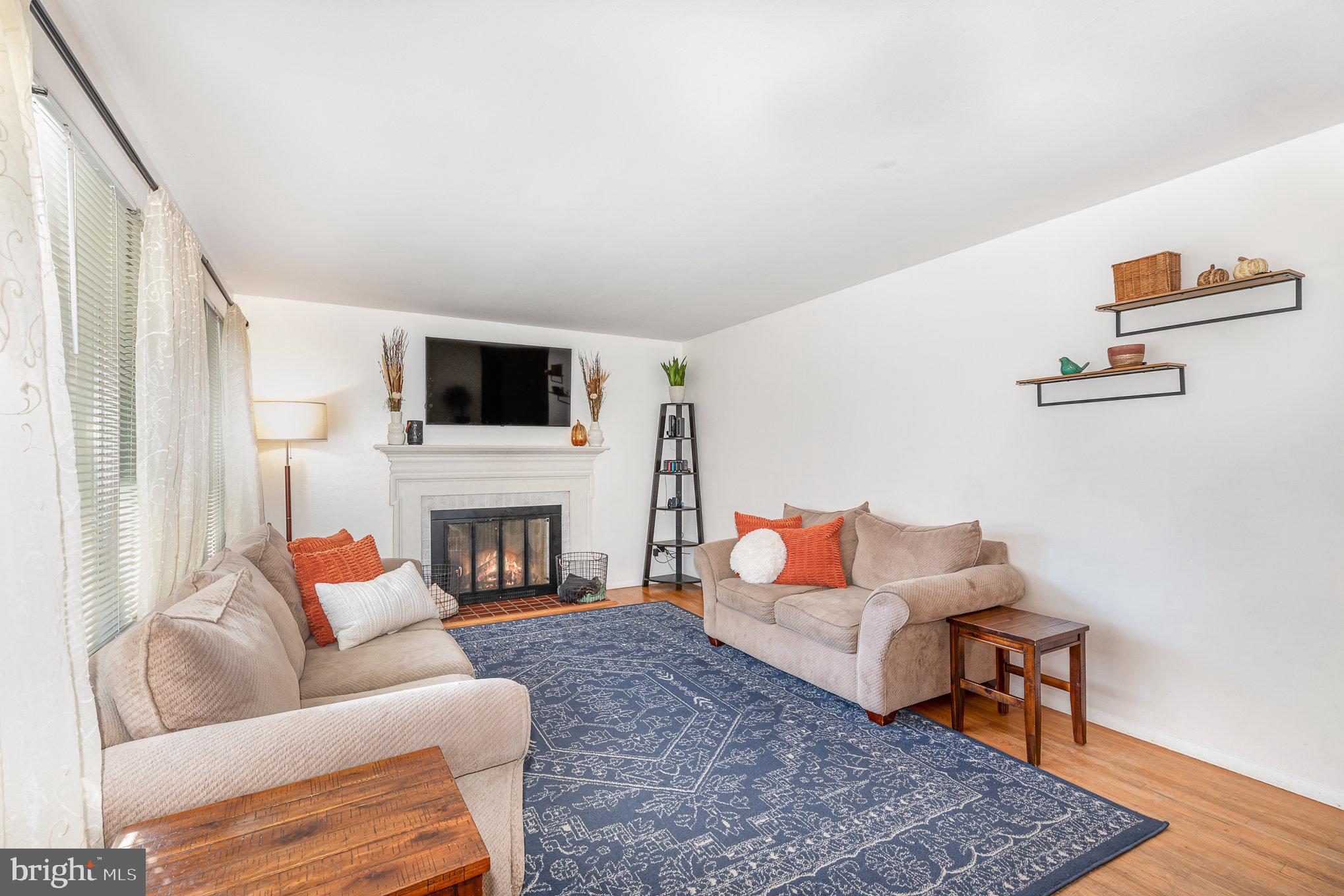 Living room with wood burning fireplace