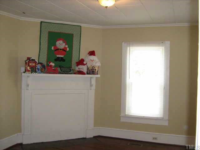 3801 Pleasant Green Road Durham, NC 27705 - Photo 4 of 12 FAMILY ROOM HAS HARDWOODS & A FIREPLACE