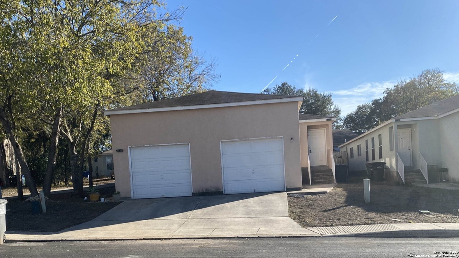 a view of a house with a street