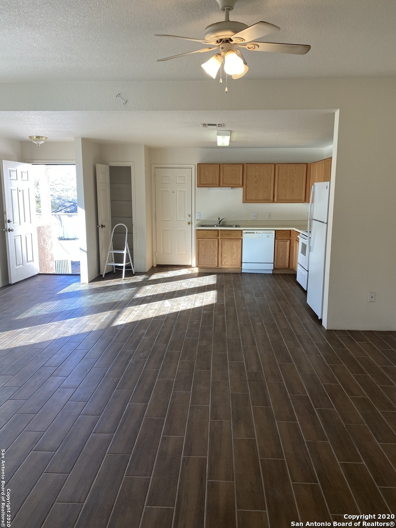 11220 Center Point Road San Antonio, TX 78233 - Photo 6 of 15 a view of an empty room with wooden floor and a window