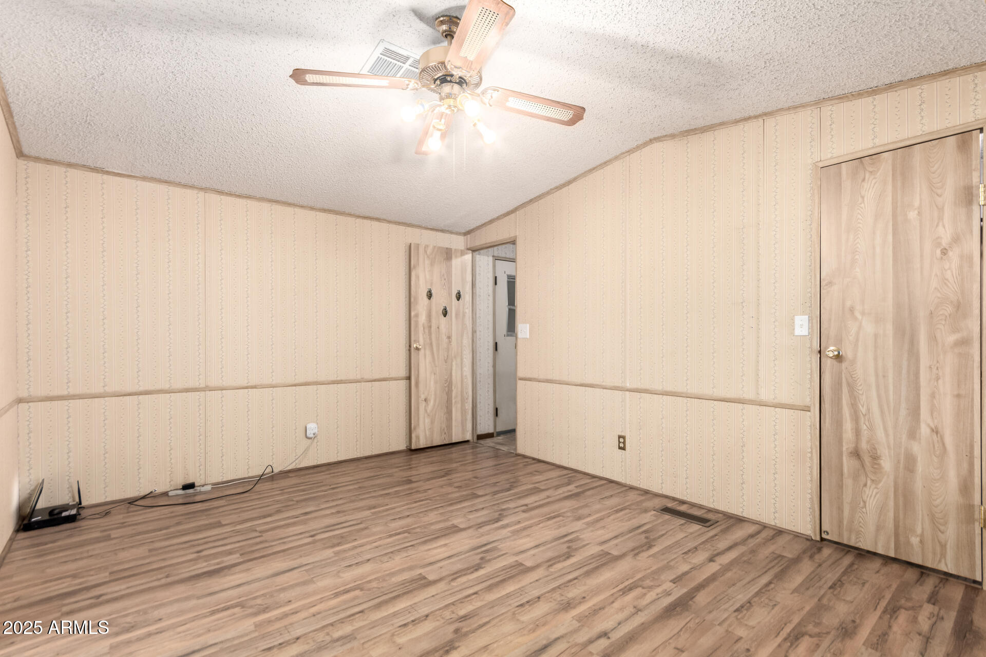 834 South Meridian Road, Unit 116 Apache Junction, AZ 85120 - Photo 17 of 42 a view of a livingroom with wooden floor
