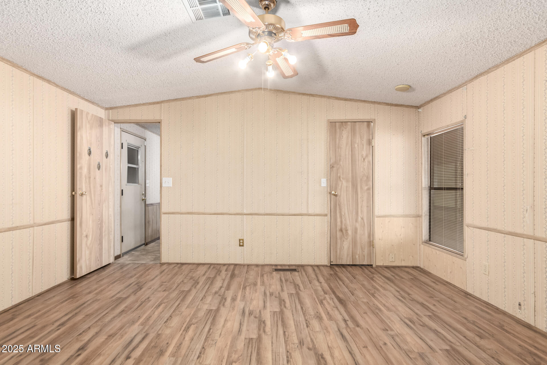 834 South Meridian Road, Unit 116 Apache Junction, AZ 85120 - Photo 18 of 42 wooden floor in an empty room with a window